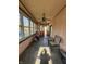 Bright front porch, ceiling fan, and access to the home at 548 Central N Ct, Indianapolis, IN 46205