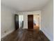 Empty bedroom with hardwood floors and multiple doors at 548 Central N Ct, Indianapolis, IN 46205