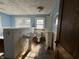 Bathroom with pedestal sink, toilet, and tiled floor at 548 Central N Ct, Indianapolis, IN 46205