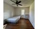 Bedroom with hardwood floors, a window, and a mattress at 548 Central N Ct, Indianapolis, IN 46205