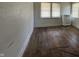 Bedroom with hardwood floors and two windows at 548 Central N Ct, Indianapolis, IN 46205