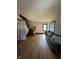 Large living room with hardwood floors and staircase at 548 Central N Ct, Indianapolis, IN 46205