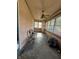 Relaxing front porch with ceiling fan and multiple windows at 548 Central N Ct, Indianapolis, IN 46205
