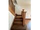 Wooden staircase with hardwood floors and wooden railings at 548 Central N Ct, Indianapolis, IN 46205