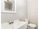 Simple bathroom with white vanity, toilet, and shower at 3226 W 46Th St, Indianapolis, IN 46228