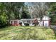 Brick ranch house with attached garage and mature landscaping at 3226 W 46Th St, Indianapolis, IN 46228
