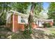 Brick ranch house with mature landscaping at 3226 W 46Th St, Indianapolis, IN 46228