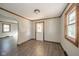 Bright entryway with hardwood floors and wood-trimmed windows and door at 2682 E 150 S, Anderson, IN 46017