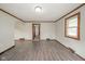 Living room with hardwood floors and access to hallway at 2682 E 150 S, Anderson, IN 46017