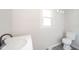 Clean bathroom with white vanity, toilet, and gray floor at 2682 E 150 S, Anderson, IN 46017