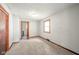 Simple bedroom with carpeted floor and wood-trimmed window at 2682 E 150 S, Anderson, IN 46017