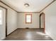 Spacious living room featuring hardwood floors and wood-trimmed windows at 2682 E 150 S, Anderson, IN 46017