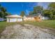 House exterior showcasing a two-car garage and wooden deck at 2682 E 150 S, Anderson, IN 46017
