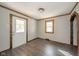 Bright entryway with hardwood floors and wood-trimmed windows and door at 2682 E 150 S, Anderson, IN 46017