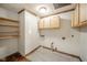 Laundry room with wood cabinets and shelving at 2682 E 150 S, Anderson, IN 46017