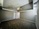 Spacious bedroom with gray walls, carpet and ceiling fan at 4839 Alameda Rd, Indianapolis, IN 46228