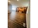Spacious living room with built-in shelving and hardwood floors at 4839 Alameda Rd, Indianapolis, IN 46228