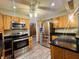 Stainless steel appliances and wood cabinets in this kitchen at 4839 Alameda Rd, Indianapolis, IN 46228