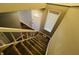 Staircase with carpet runner, view of entryway and front door at 4839 Alameda Rd, Indianapolis, IN 46228