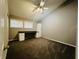 Bedroom with gray walls, ceiling fan and built-in desk at 4839 Alameda Rd, Indianapolis, IN 46228