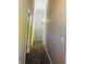 Gray-walled hallway with carpet and multiple doors at 4839 Alameda Rd, Indianapolis, IN 46228
