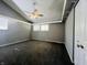 Spacious bedroom with gray walls, carpet, and ceiling fan at 4839 Alameda Rd, Indianapolis, IN 46228