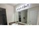 Bathroom with double sinks, large mirror, and linen closet at 7625 Firecrest Ln, Camby, IN 46113