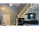 Staircase and TV setup in the entryway at 7625 Firecrest Ln, Camby, IN 46113