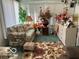 Bright sunroom with floral decor and comfy seating at 4434 E 46Th St, Indianapolis, IN 46226