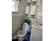 Clean bathroom with white vanity and tiled walls at 4434 E 46Th St, Indianapolis, IN 46226