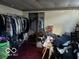 Full-length closet with clothes and personal items at 4434 E 46Th St, Indianapolis, IN 46226