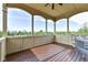 Covered porch with fireplace and scenic views at 10881 Harbor Bay Dr, Fishers, IN 46040