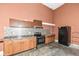 Kitchen with wood cabinets, tile backsplash and appliances at 10881 Harbor Bay Dr, Fishers, IN 46040