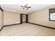 Basement bedroom with ceiling fan and dark brown trim at 10881 Harbor Bay Dr, Fishers, IN 46040