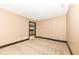 Finished basement room with carpeted floor and access to bar area at 10881 Harbor Bay Dr, Fishers, IN 46040