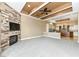 Spacious living room with stone fireplace and built-in TV at 10881 Harbor Bay Dr, Fishers, IN 46040