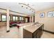 Basement bar area with wet bar and seating area at 10881 Harbor Bay Dr, Fishers, IN 46040