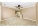 Large bedroom with ceiling fan and access to hallway at 10881 Harbor Bay Dr, Fishers, IN 46040