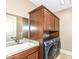 Laundry room with washer, dryer and upper cabinets at 10881 Harbor Bay Dr, Fishers, IN 46040