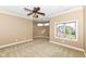 Bright bedroom featuring a ceiling fan and window with a view at 10881 Harbor Bay Dr, Fishers, IN 46040