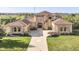 Luxury home with stone and stucco exterior and three car garage at 10881 Harbor Bay Dr, Fishers, IN 46040