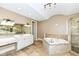 Upscale bathroom featuring double vanities, a soaking tub, and a shower at 10881 Harbor Bay Dr, Fishers, IN 46040