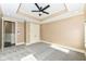 Bright bedroom featuring a ceiling fan, double doors, and carpeted floors at 10881 Harbor Bay Dr, Fishers, IN 46040
