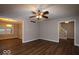 Spacious living room featuring hardwood floors and ceiling fan at 1045 Swinford St, Shelbyville, IN 46176