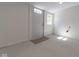 Bright laundry room with exterior access and vinyl flooring at 1521 Indiana Ave, Columbus, IN 47201