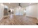 Living room with hardwood floors and view of kitchen and stairs at 1521 Indiana Ave, Columbus, IN 47201