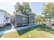 Gray house with white trim, landscaping, and a sidewalk at 1521 Indiana Ave, Columbus, IN 47201