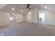 Large main bedroom with grey carpet, ensuite bathroom, and multiple rooms at 1521 Indiana Ave, Columbus, IN 47201