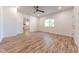 Hardwood floors and ceiling fan in this bright living room at 1521 Indiana Ave, Columbus, IN 47201