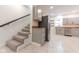 Carpeted stairs leading down to a finished basement at 1521 Indiana Ave, Columbus, IN 47201